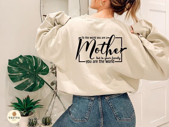 To The World You Are A Mother But To Your Family You Are The World Sweater